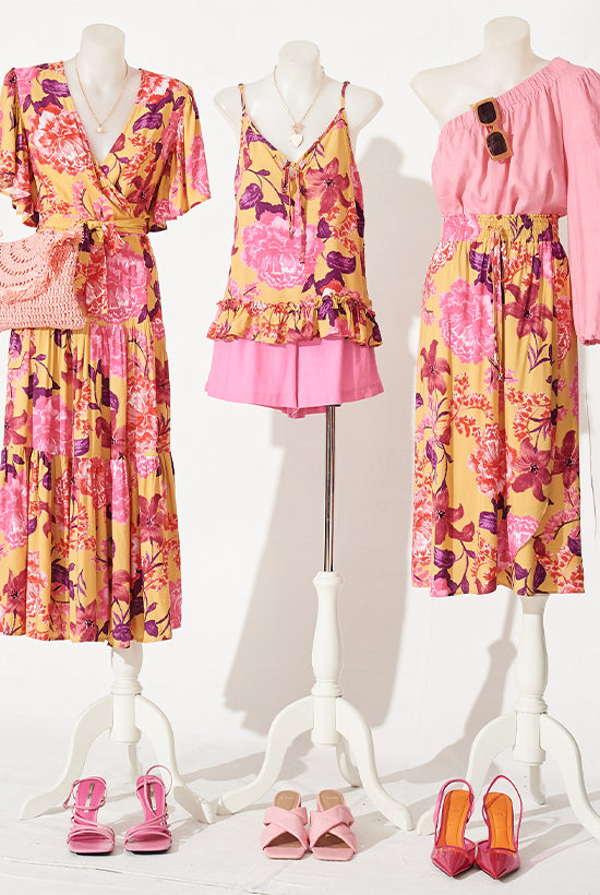 3 mannequins with different pink and orange floral outfits