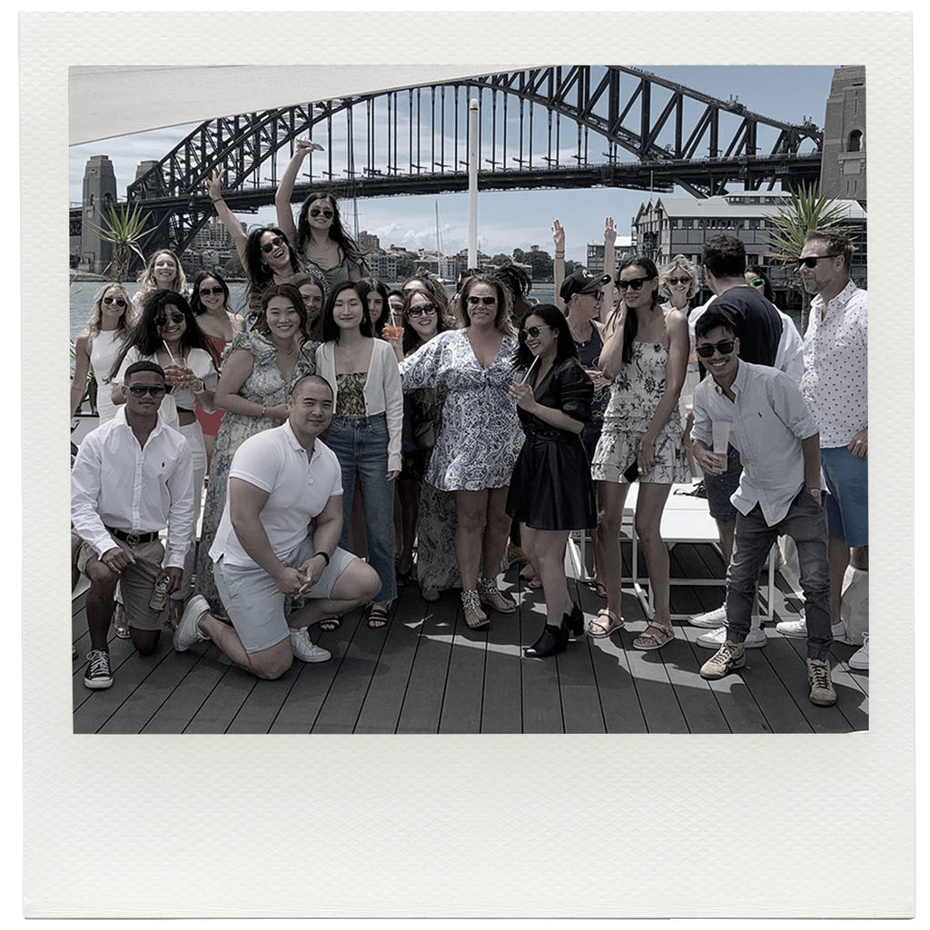 Team Staff photo in front of sydney harbour bridge. 