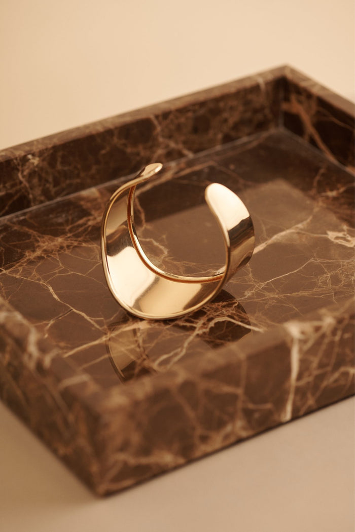 Aura Sculptural Open Bangle in Gold focus shoot flatlay