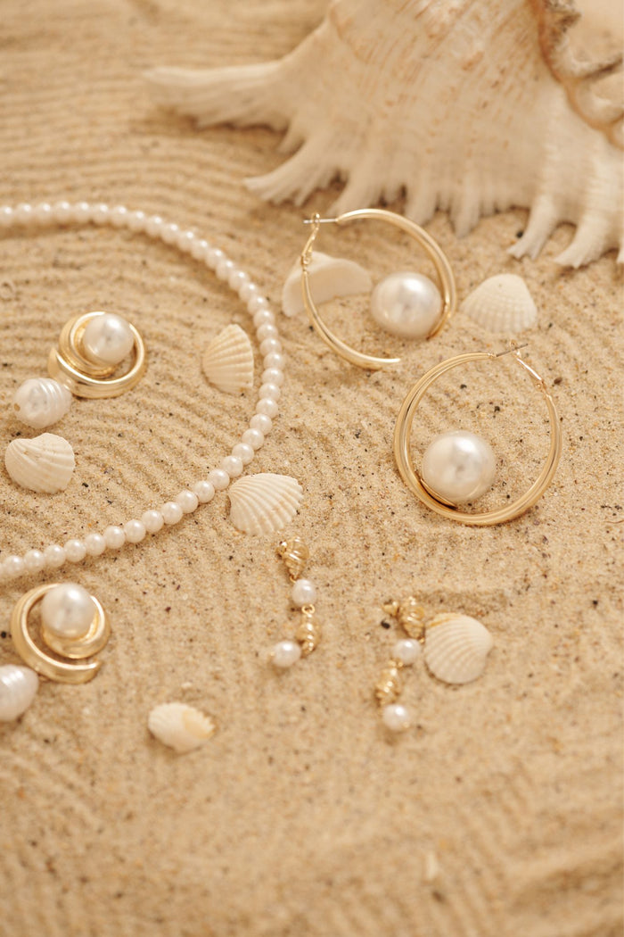 Vera Drop Earrings in 18K Gold Sculpted Pearl focus shoot flatlay