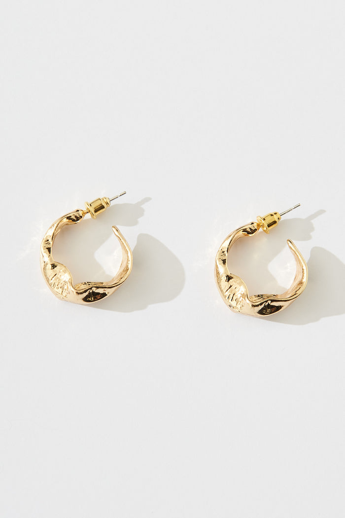August + Delilah Stare Hoop Earrings In Gold - flatlay