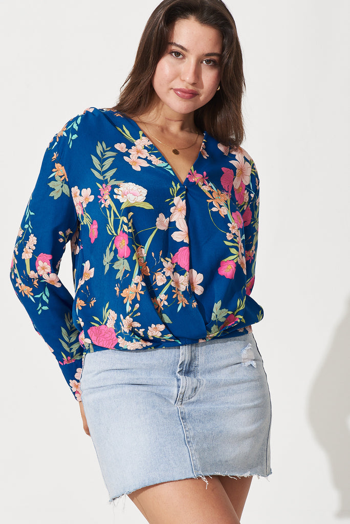 Gwyneth Mock Wrap Top In Blue With Pink Floral Print - front