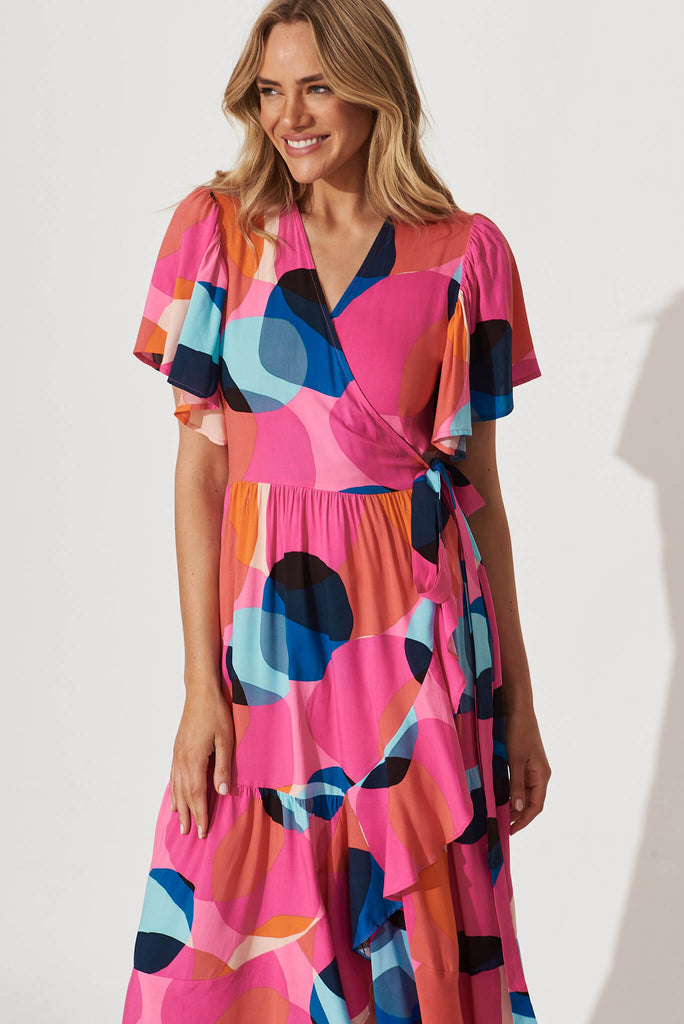 Jaida Midi Wrap Dress In Candy Pink With Blue Spot - front