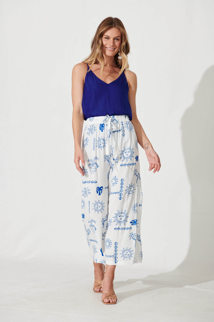 Castaway Pant In White With Blue Sun Print - full length