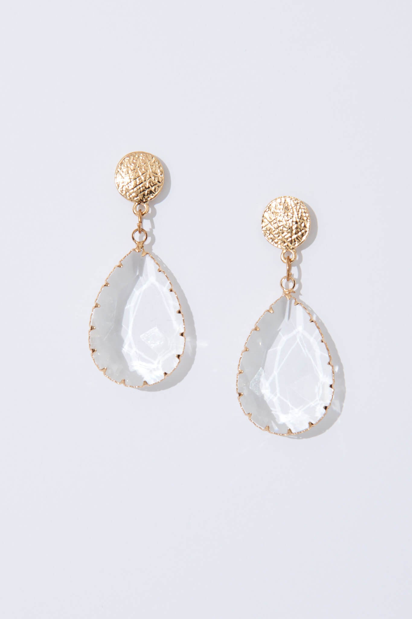 August + Delilah Harriet Drop Earrings In Gold With Transparent Stone - flatlay