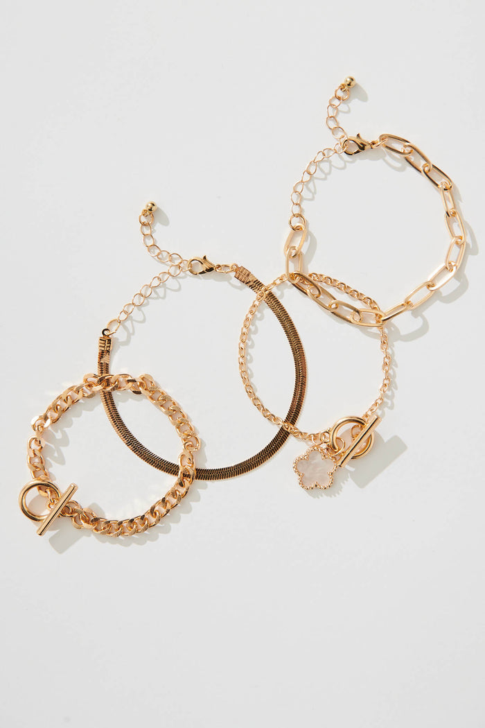 Bambi Four Layered Bracelet In Gold With Pearlescent Clover - flatlay