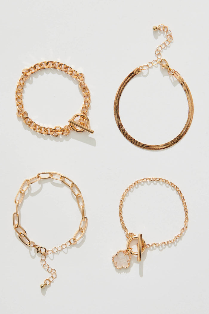 Bambi Four Layered Bracelet In Gold With Pearlescent Clover - flatlay