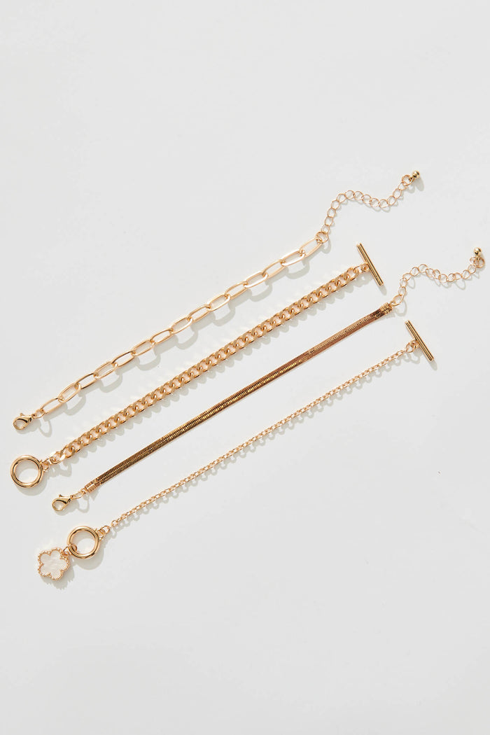 Bambi Four Layered Bracelet In Gold With Pearlescent Clover - flatlay