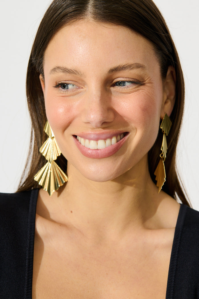 Ruby Drop Earrings in Gold on model front