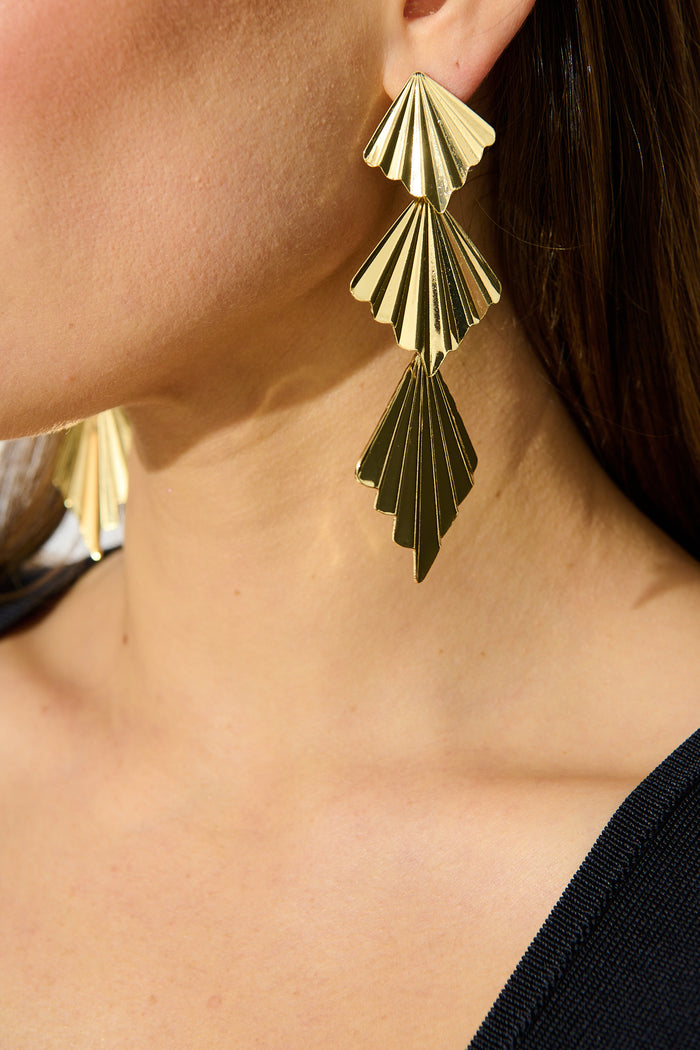 Ruby Drop Earrings in Gold on model side cropped