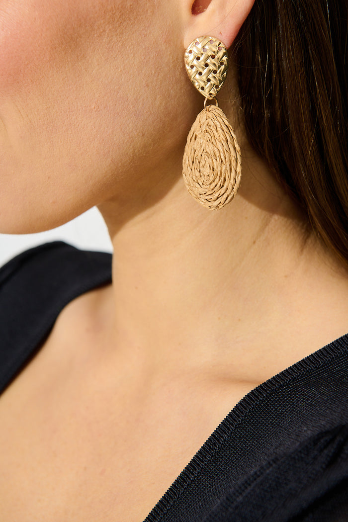 Sara Drop Earrings in Natural Rattan on model side cropped