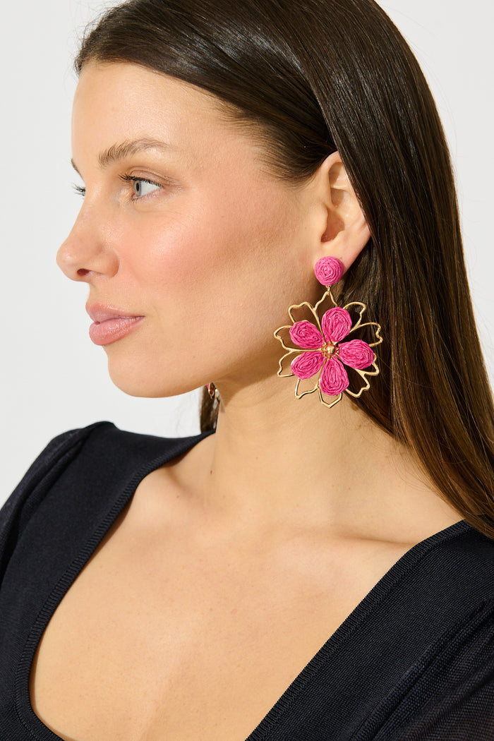 Pia Drop Earrings in Gold with Pink Rattan on model side