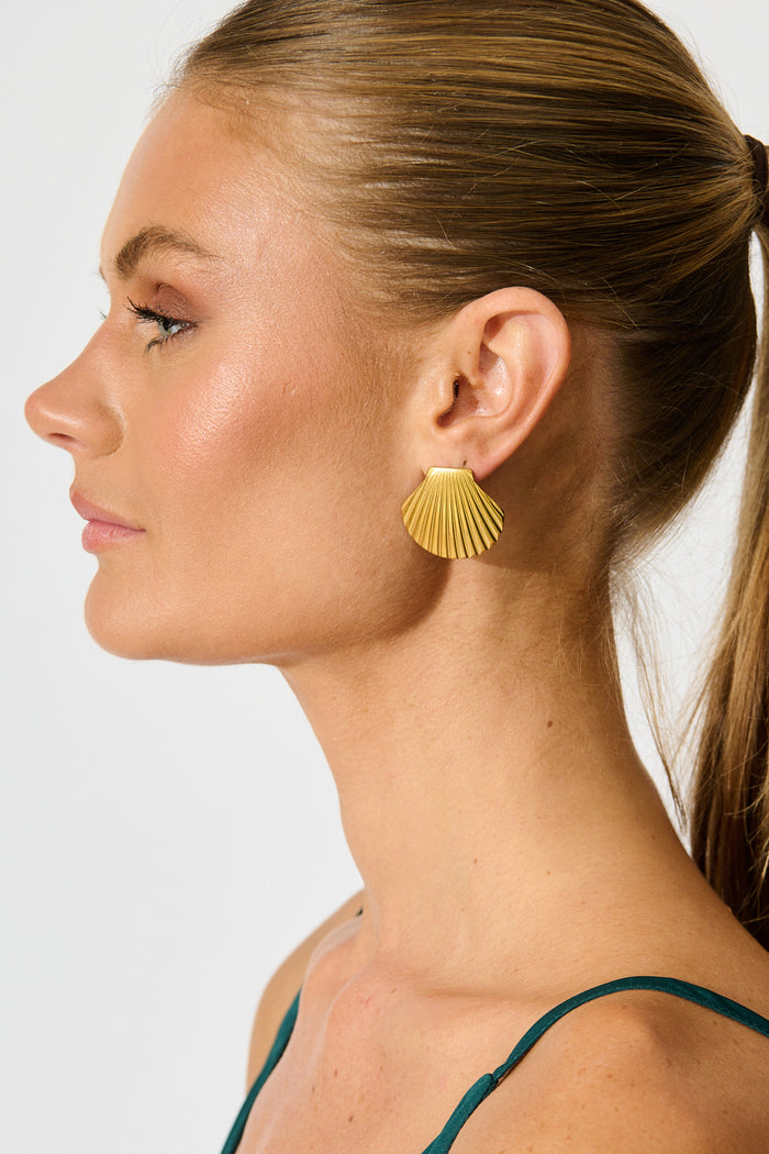Mykonos Shell Stud Earrings in 18K Gold Plated on model side