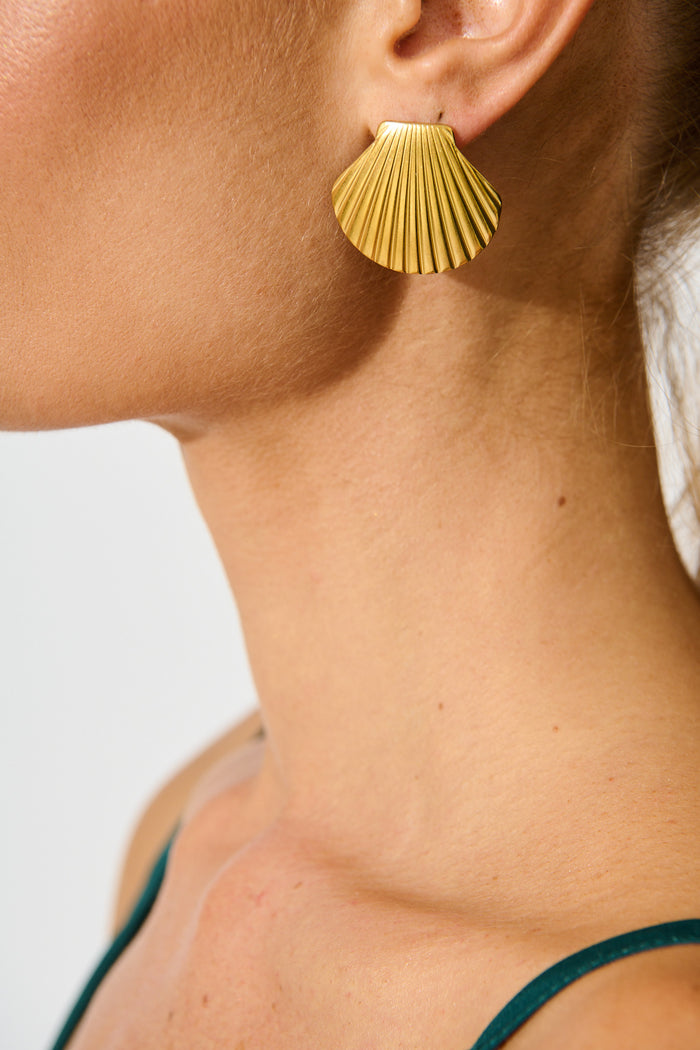 Mykonos Shell Stud Earrings in 18K Gold Plated on model side cropped