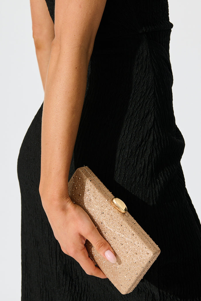 Clara Clutch Bag in Rose Gold on model closeup