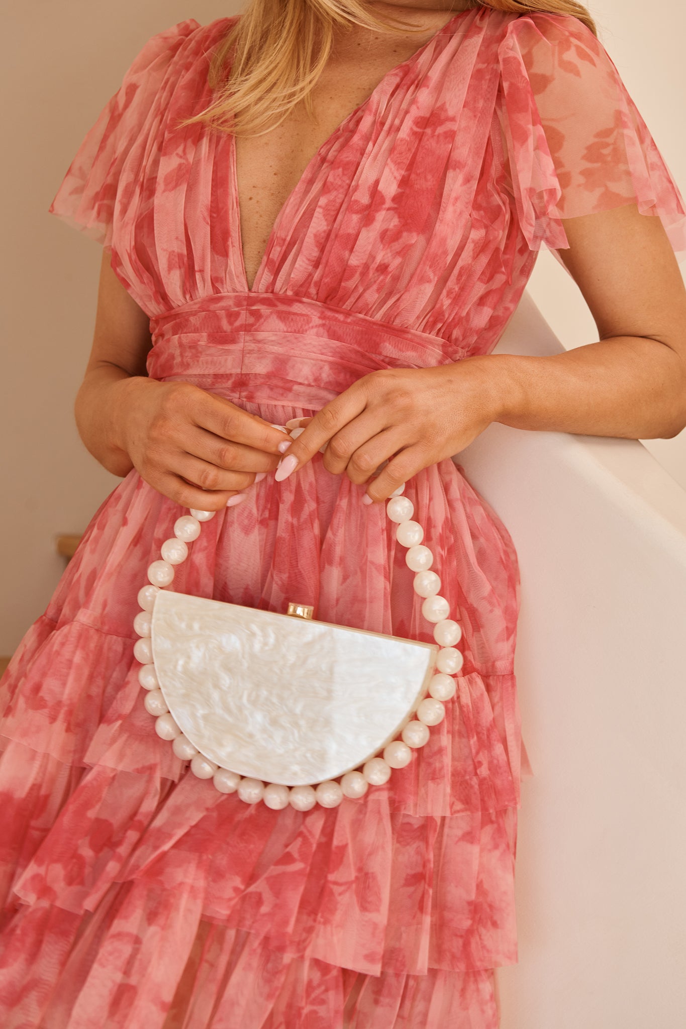 Delilah Beaded Clutch Bag in Pearlescent Acrylic campaign on model front