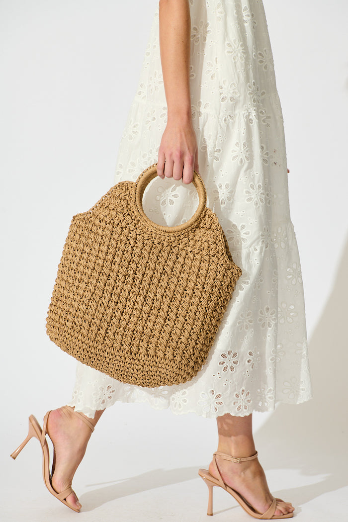 Anouk Circle Handle Tote Bag in Natural Raffia on model side
