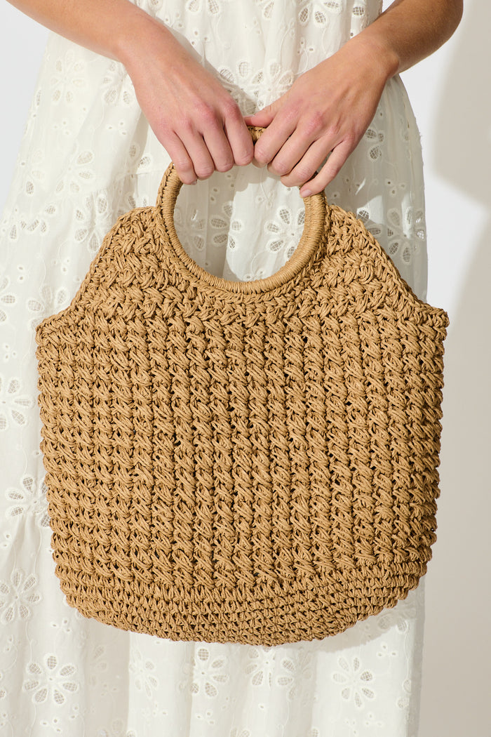 Anouk Circle Handle Tote Bag in Natural Raffia on model closeup front