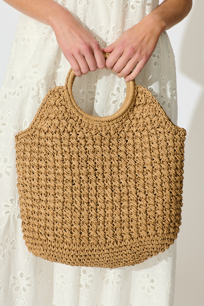Anouk Circle Handle Tote Bag in Natural Raffia on model closeup front