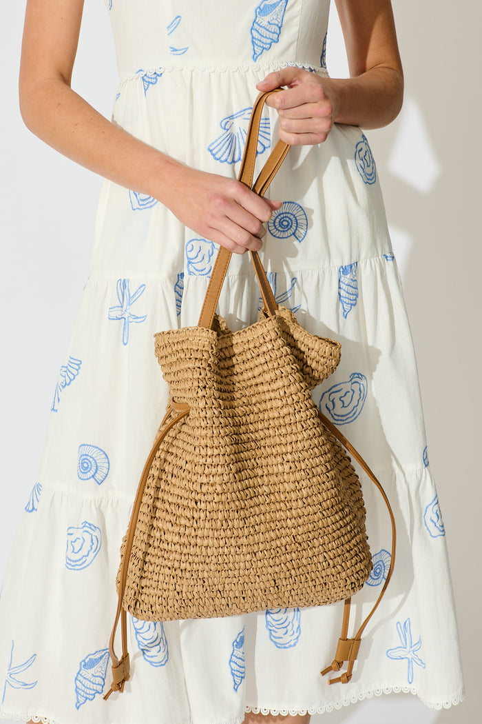 Delilah Shoulder Bag in Tan Woven Straw on model close up