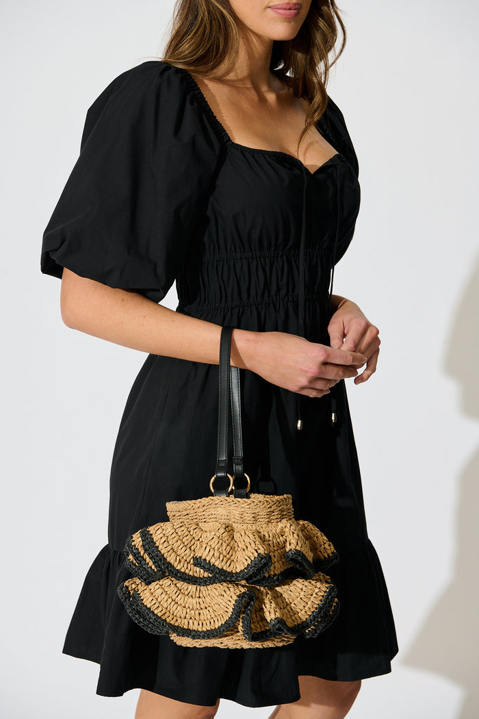 Juliette Ruffle Basket Bag in Natural Straw on model front