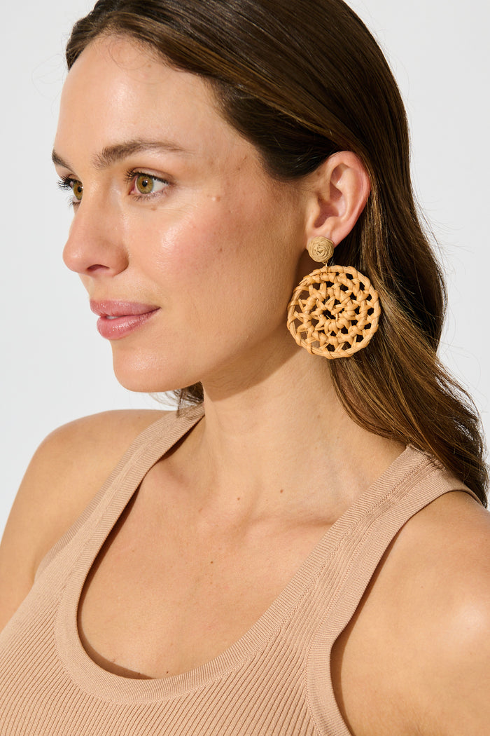 Leana Drop Earrings in Natural Raffia with Gold Accent on model side