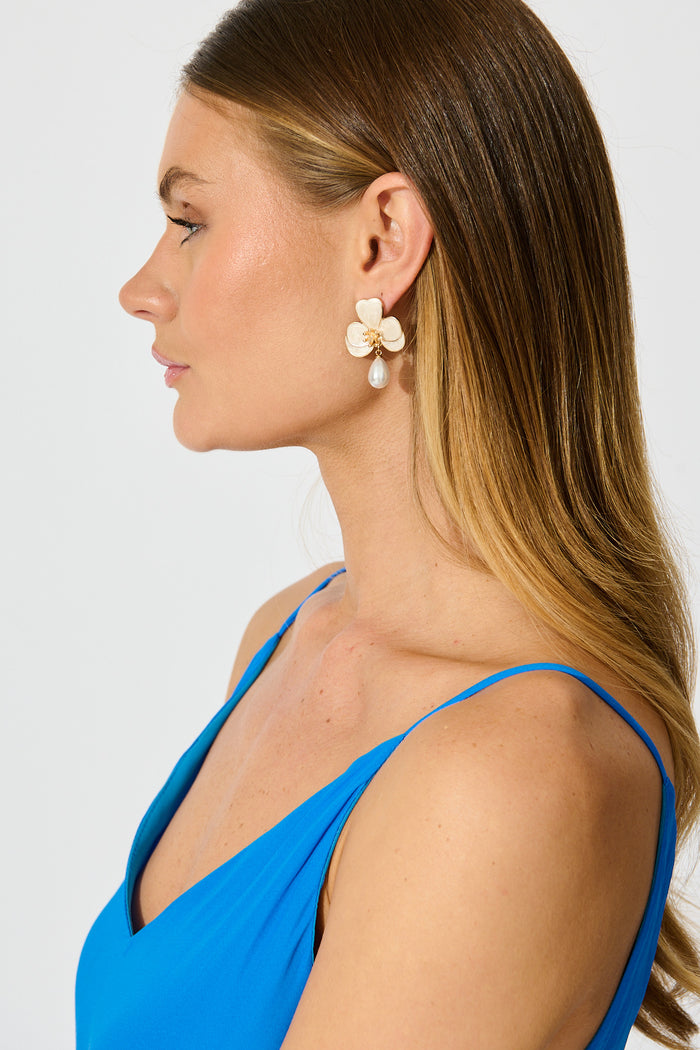 Osteria Orchid Drop Earrings in Gold with Pearlescent on model side