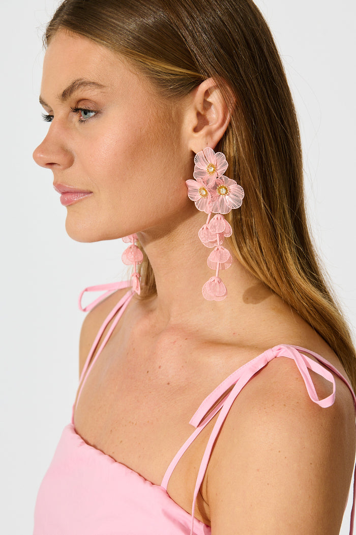 Botanica Drop Earrings in Blush with Gold on model side