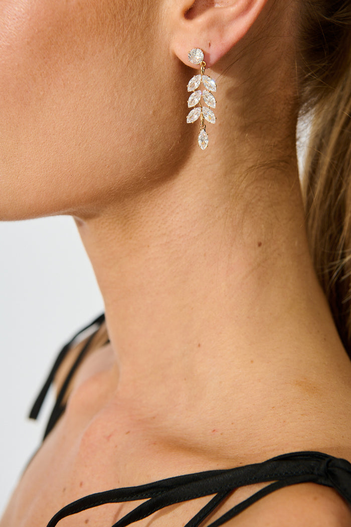 Timeless Drop Earrings in Silver Gold Zirconia on model side close up