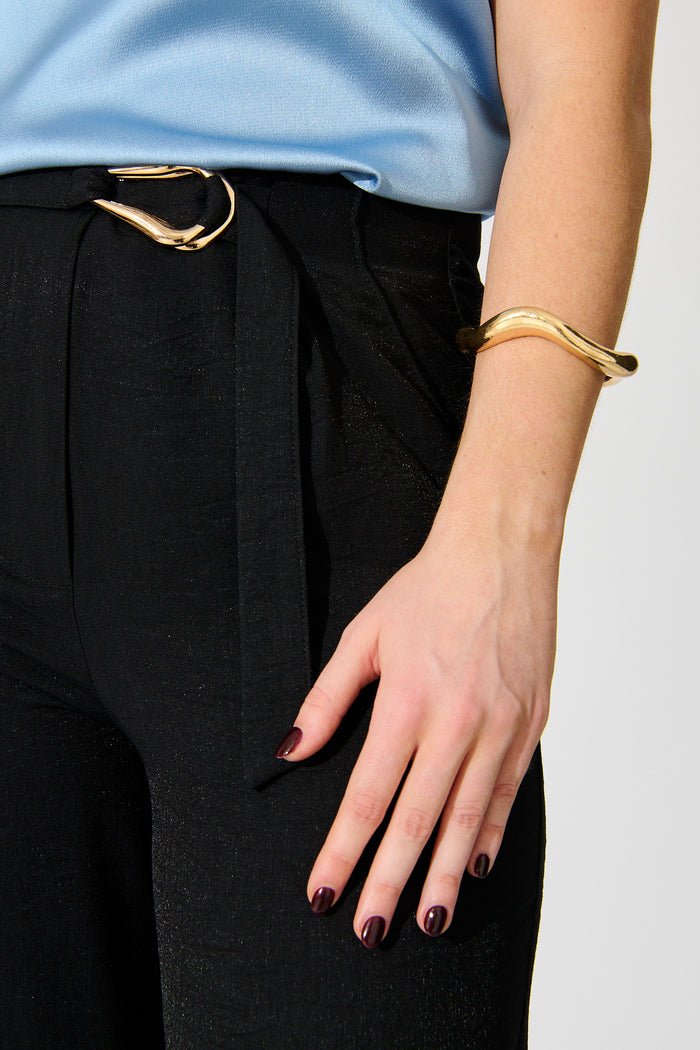 Freya Sculptural Cuff Bangle in Gold on model side