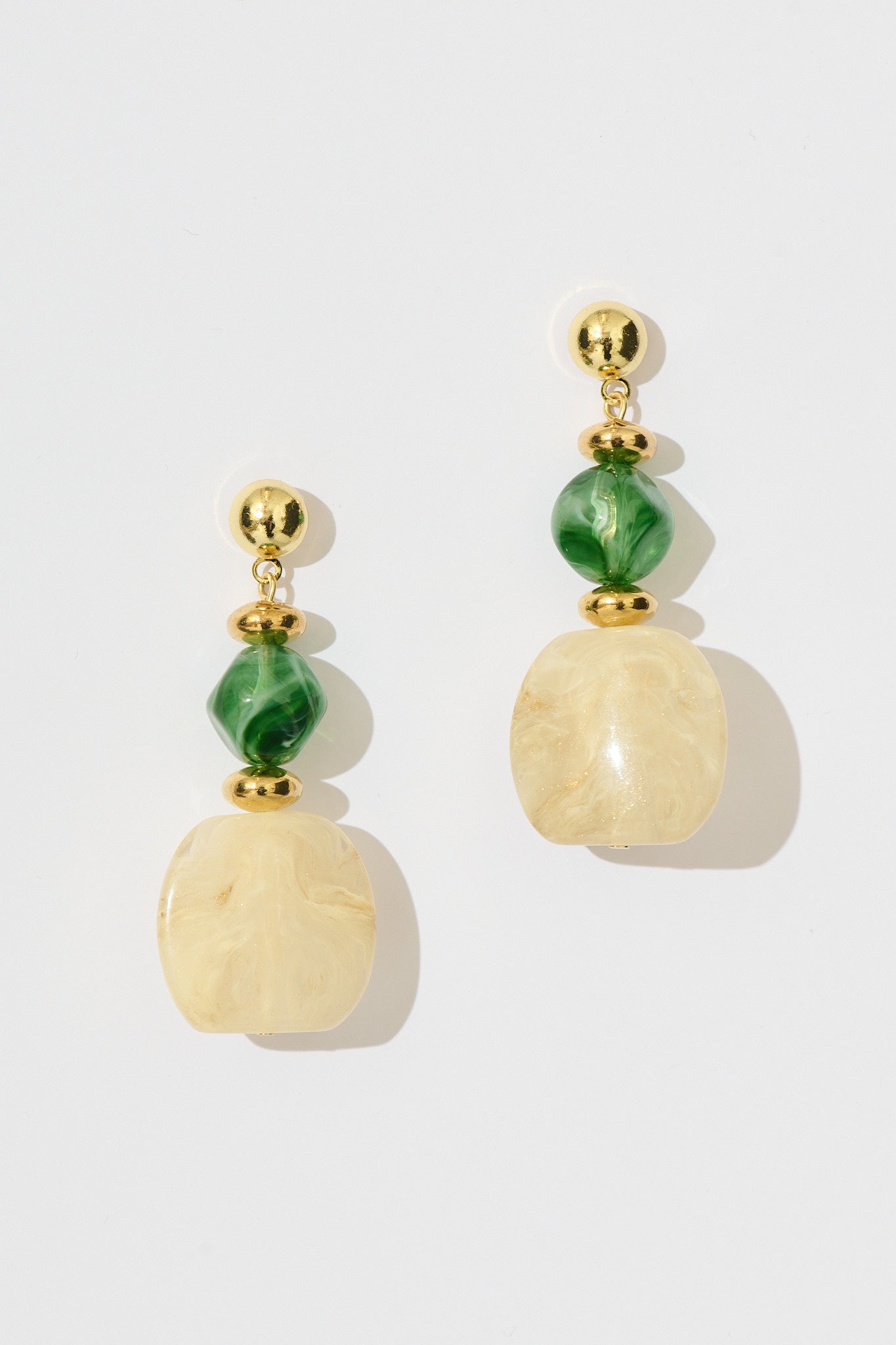 Zara Drop Earrings in Jade Green and Champagne Resin flatlay
