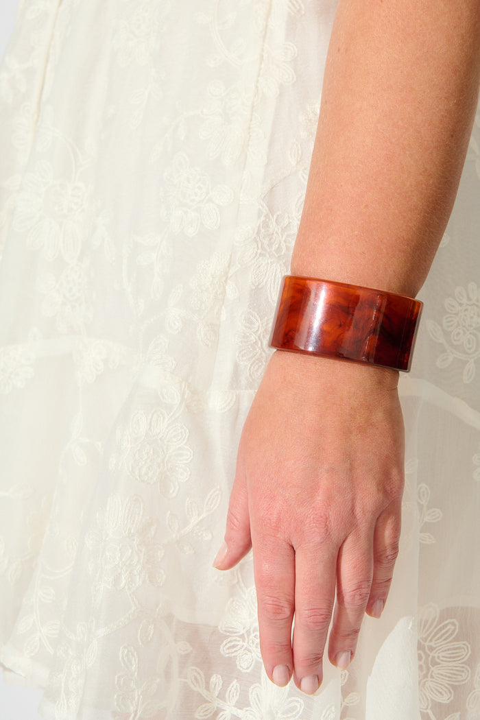 Carmen Cuff Bangle in Amber Resin on model close up