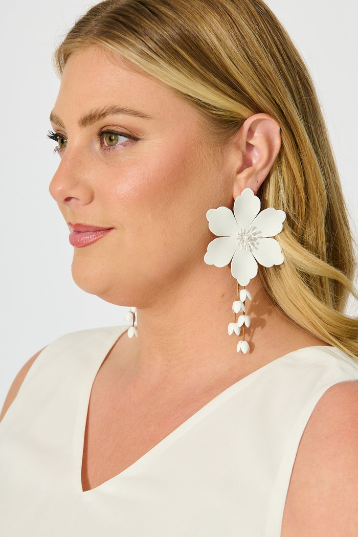 Yuki Earrings in White Blossom with Dangling Petals on model side