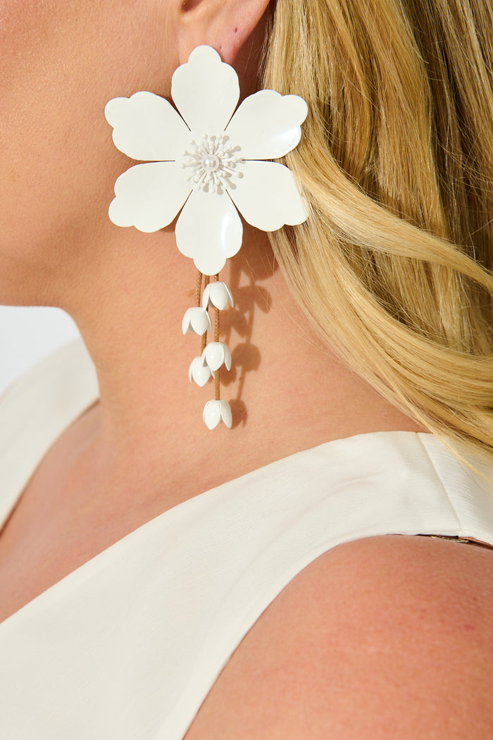 Yuki Earrings in White Blossom with Dangling Petals on model close up