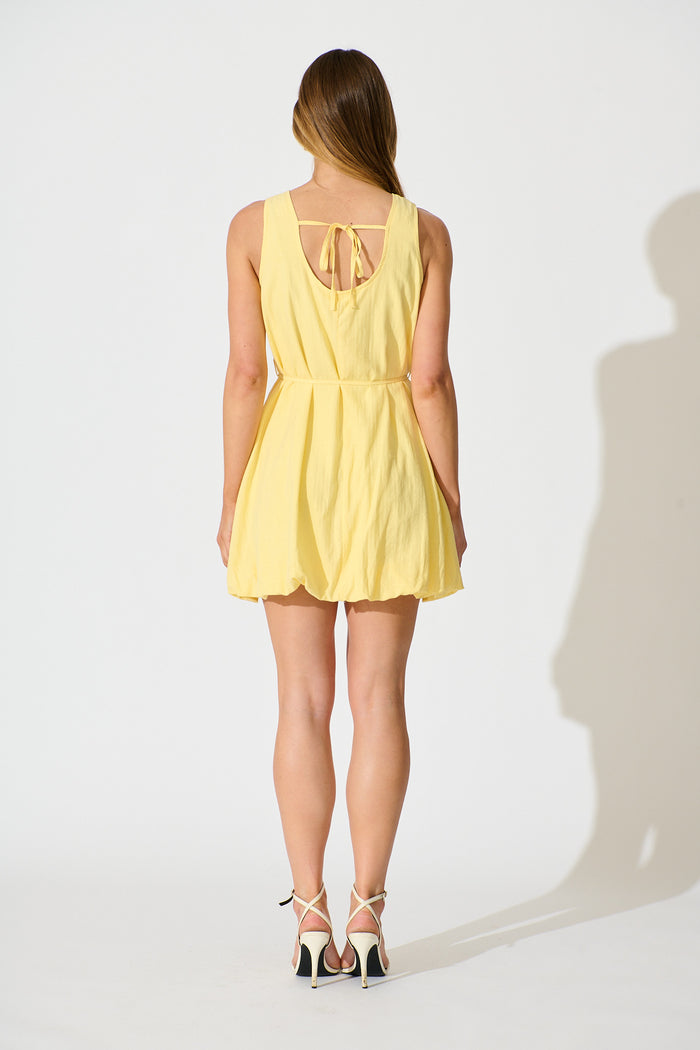 Aleris Bubble Hem Dress in Butter Yellow Cotton back