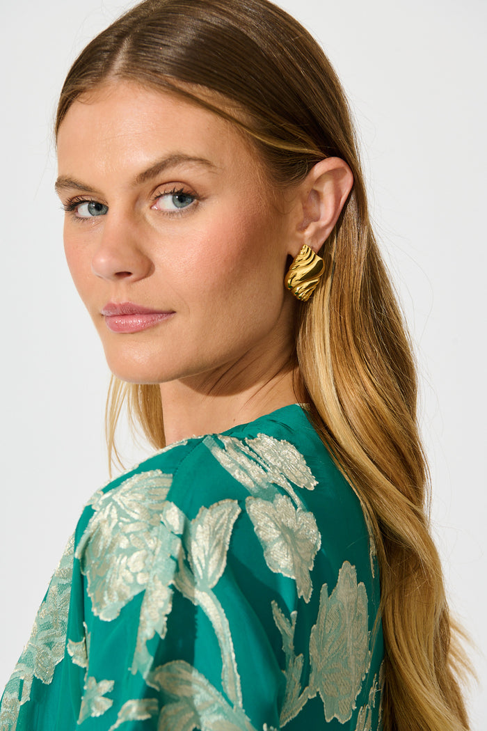 Conch Shell Stud Earrings in 18K Gold Plated on model side