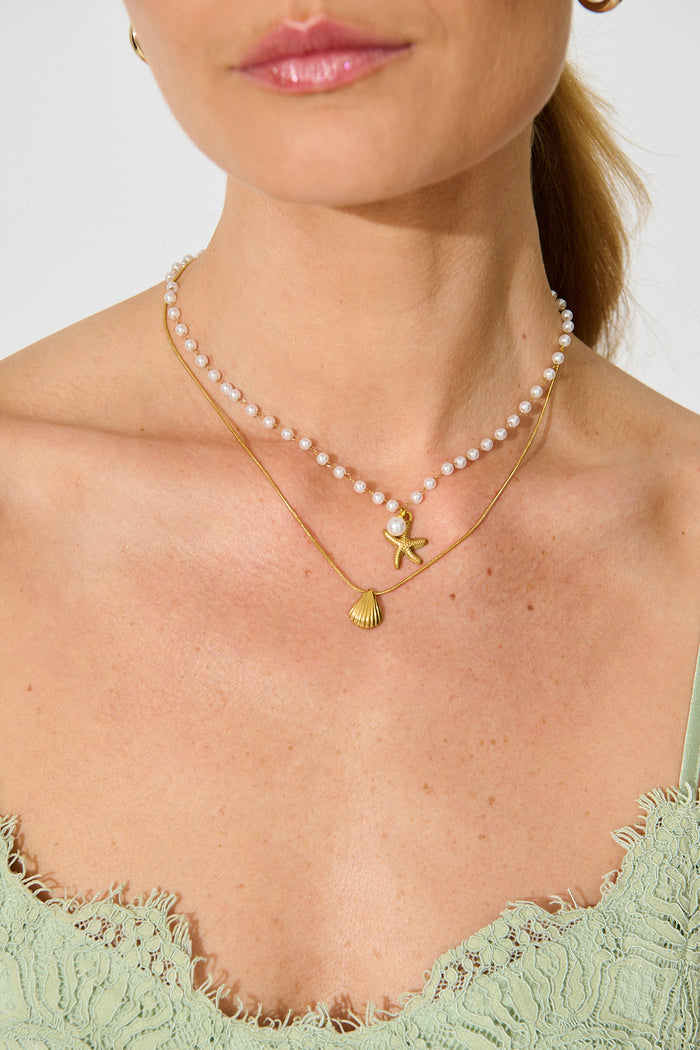 Palm Cove Double Layered Necklace in Gold with Pearl on model close up