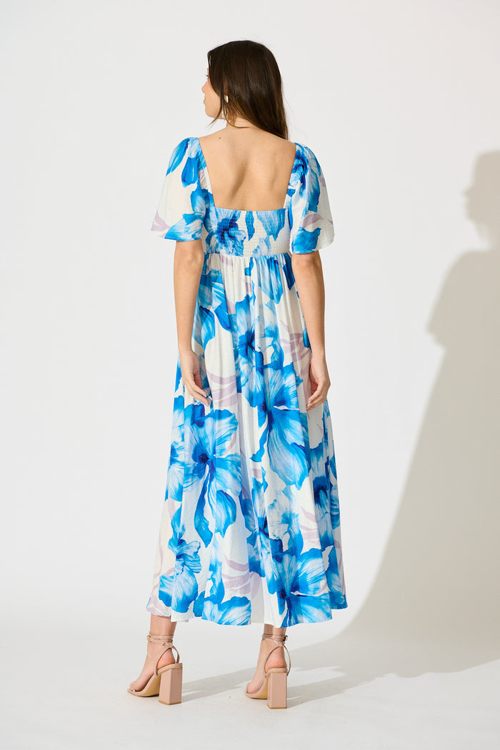 Indira Maxi Dress in White with Blue Floral back