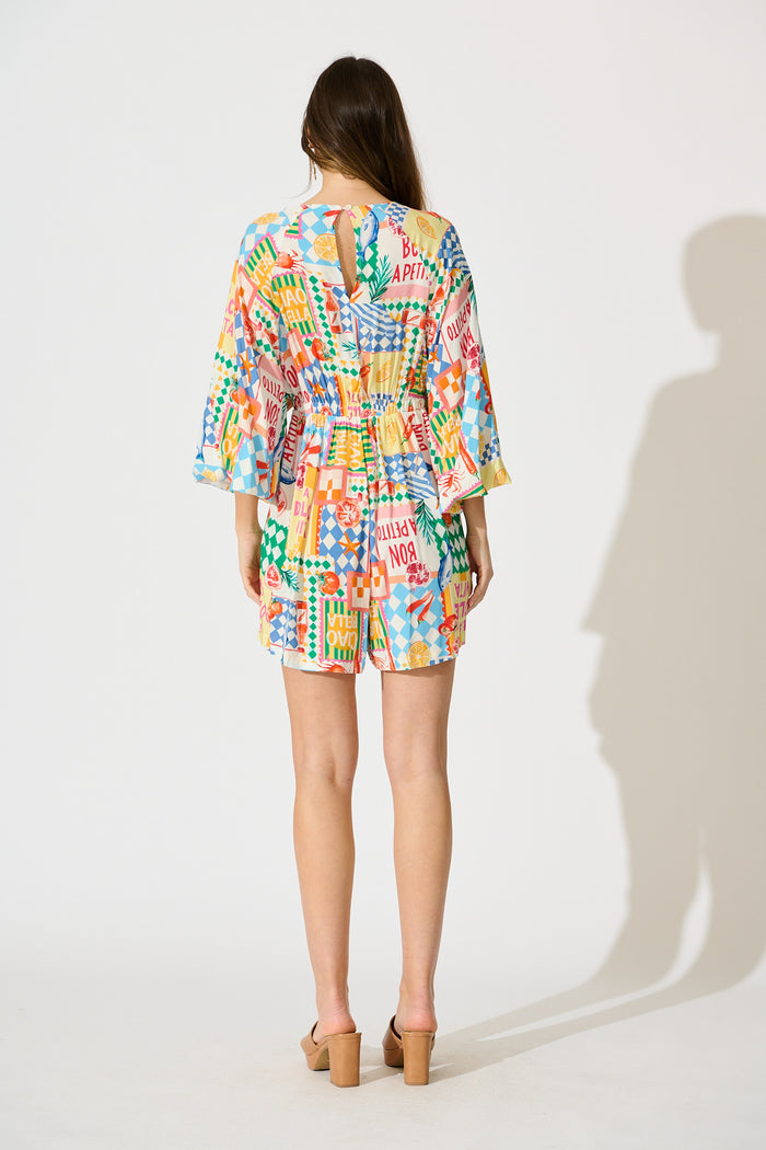 Otillie Playsuit in White Multi Conversational Print back