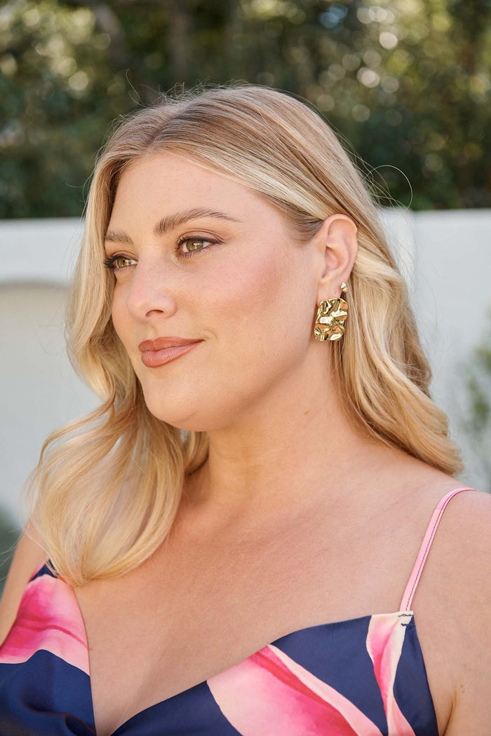 Lola Stud Earrings in Gold campaign on model side