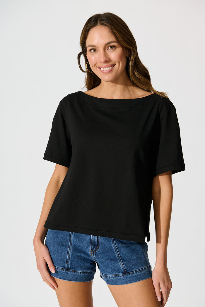 Aveda Off Shoulder T Shirt in Black front