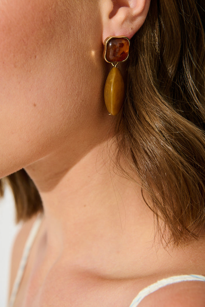 Joy Drop Earrings in Chocolate Resin on model close up