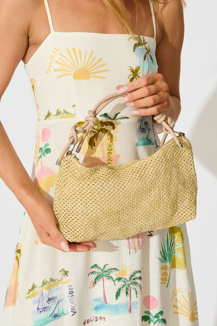 Aveline Hand Bag in Natural Woven with Blush Strap on model front