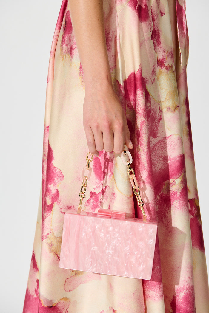 Candice Clutch in Pearlescent Pink on model side