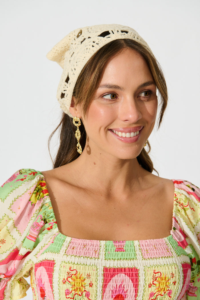 Chiara Crochet Headscarf in Cream on model front