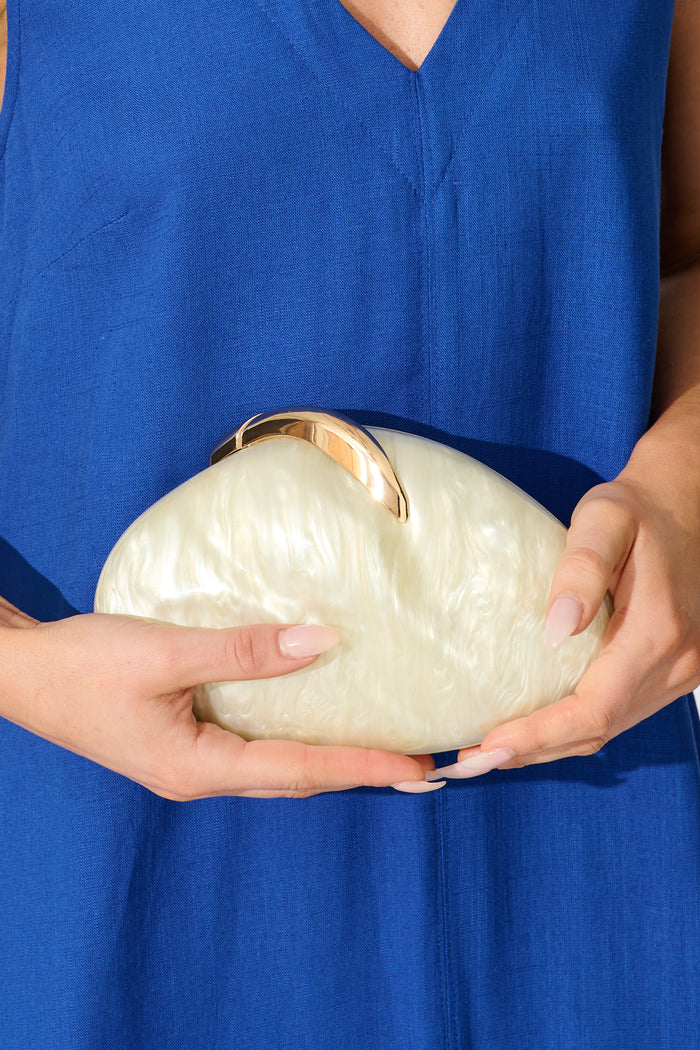 Elena Clutch Bag in Pearl Shell Acrylic on model close up