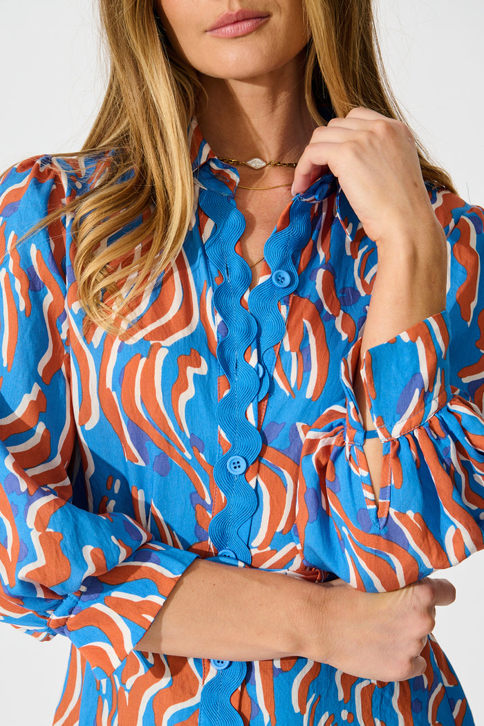 Charmain Dress in Blue with Orange Print detail