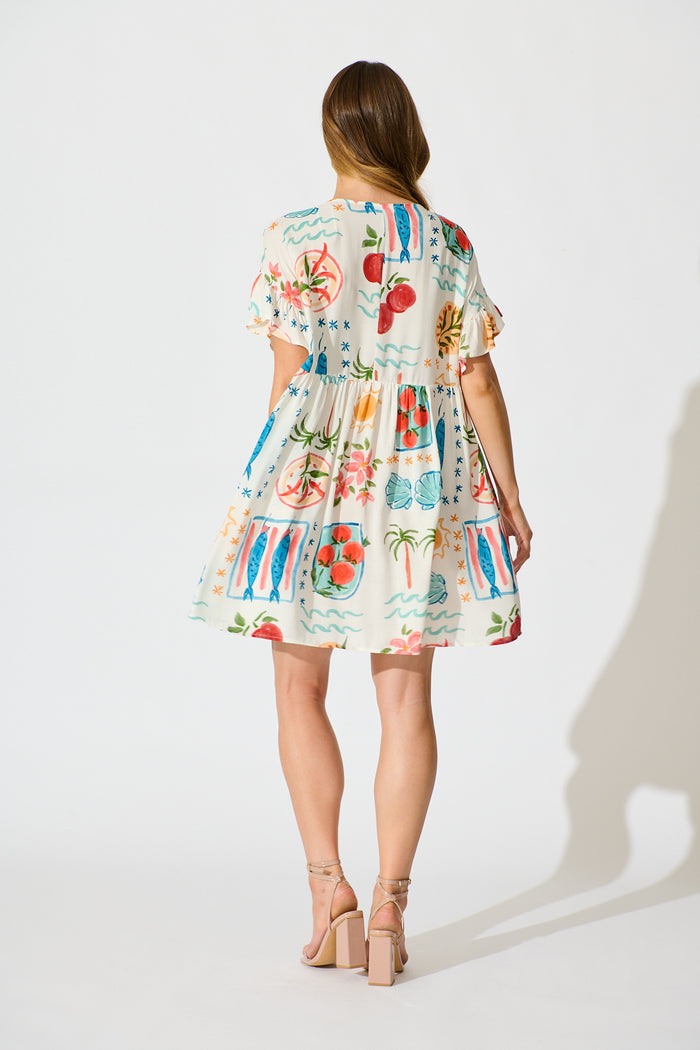 Escape Smock Dress in Cream with Multi Conversational Print back