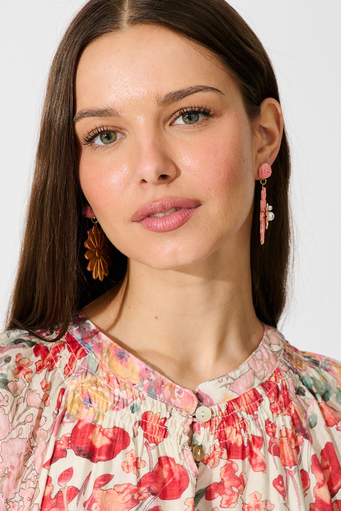 Flora Drop Earrings in Pink and Gold Daisy Raffia on model front