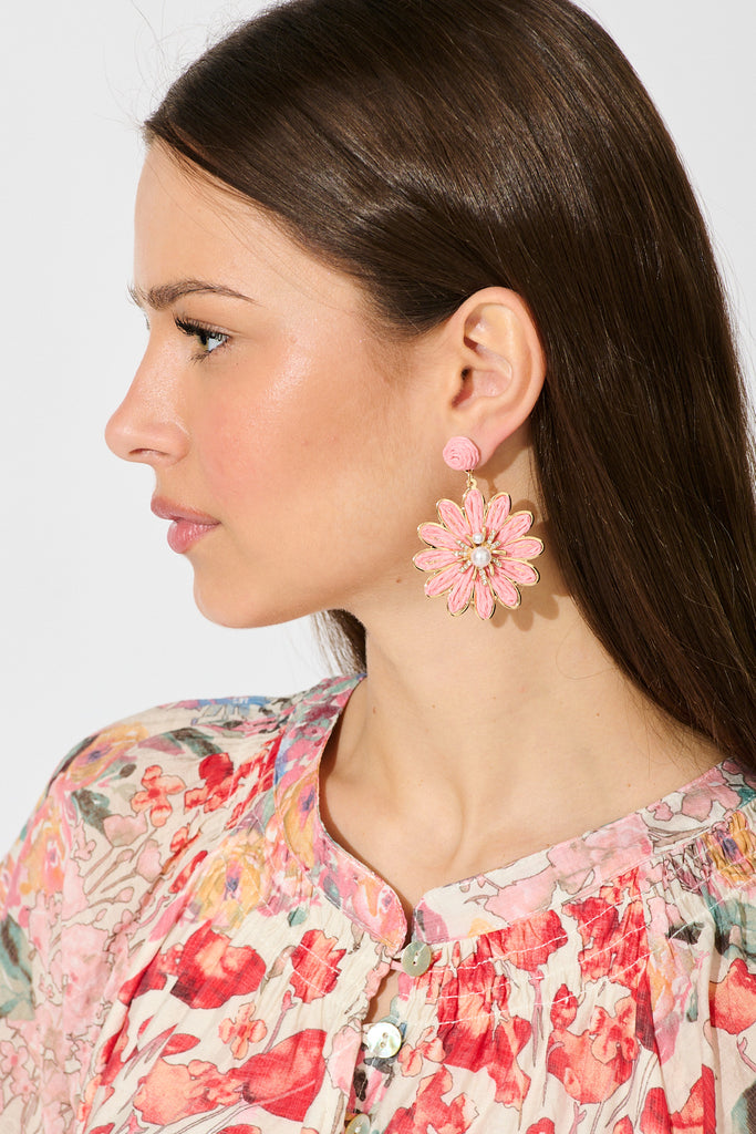 Flora Drop Earrings in Pink and Gold Daisy Raffia on model side